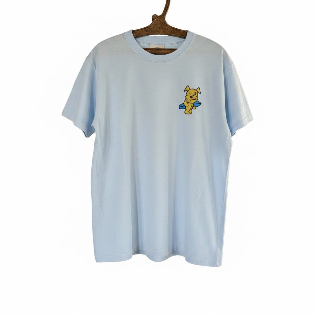 Light blue t-shirt with a cartoon character and yellow cap on a hanger.