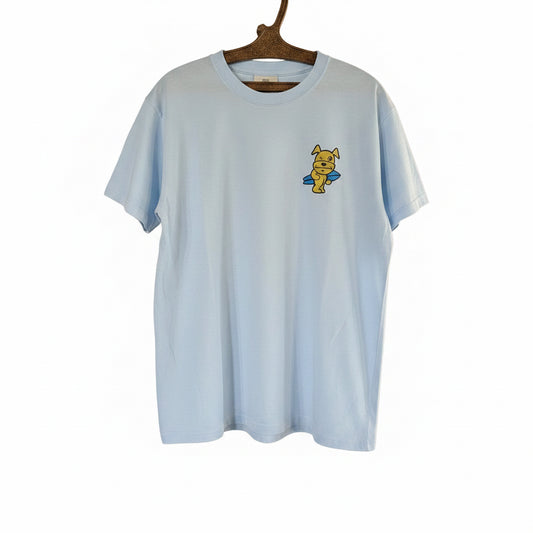Light blue t-shirt with a cartoon character and yellow cap on a hanger.